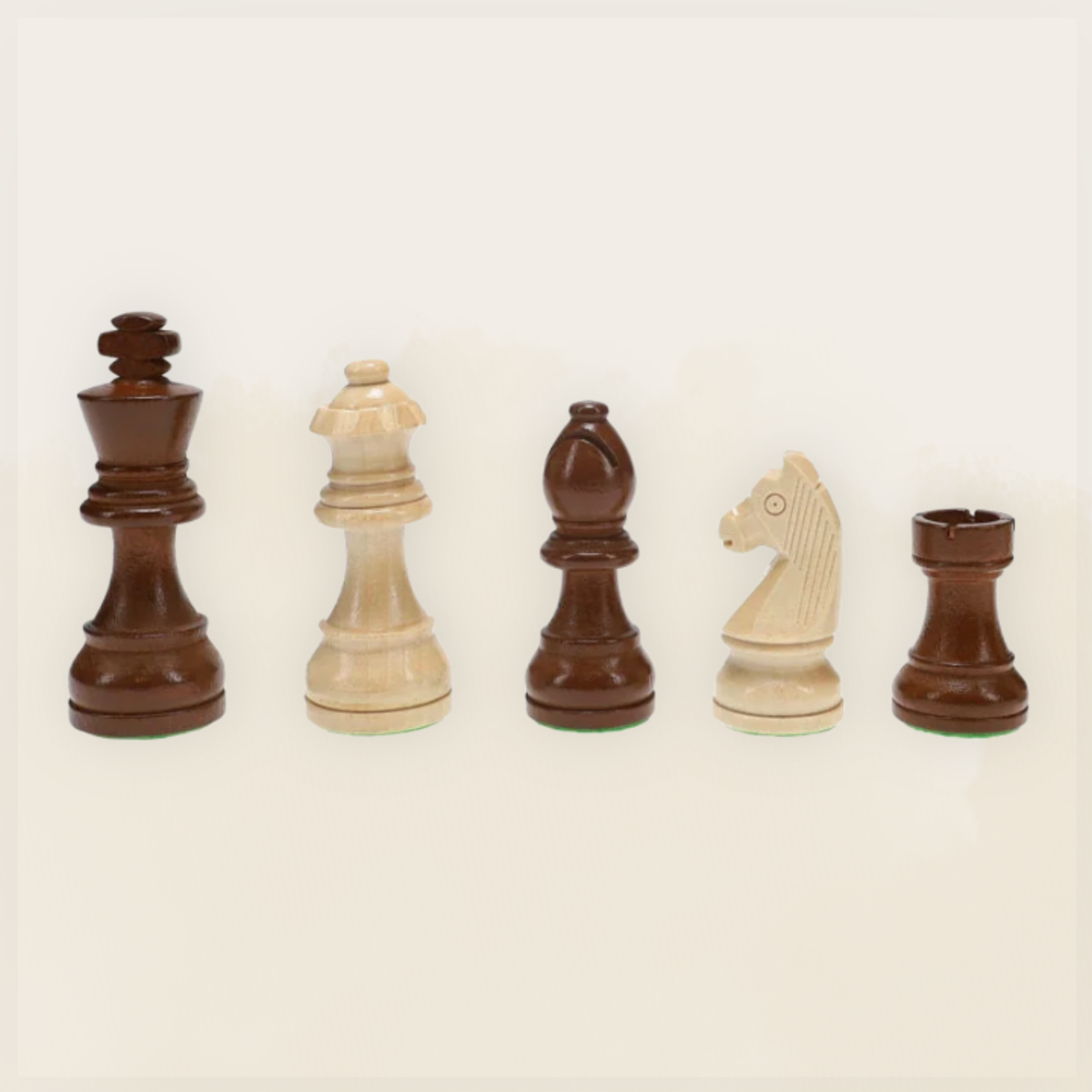 French Staunton chess pieces including king, queen, bishop, knight, and rook in light and dark wood